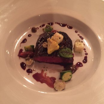 One Eleven at the Capital signature dishes Menu changes seasonally; known for dishes like Pan-Seared Scallops, Arkansas Rice Grits, and Prime Steaks.